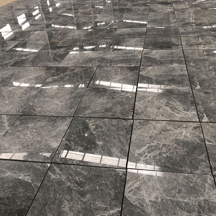 What factors should be considered when choosing the size and shape of marble tiles for a particular space?